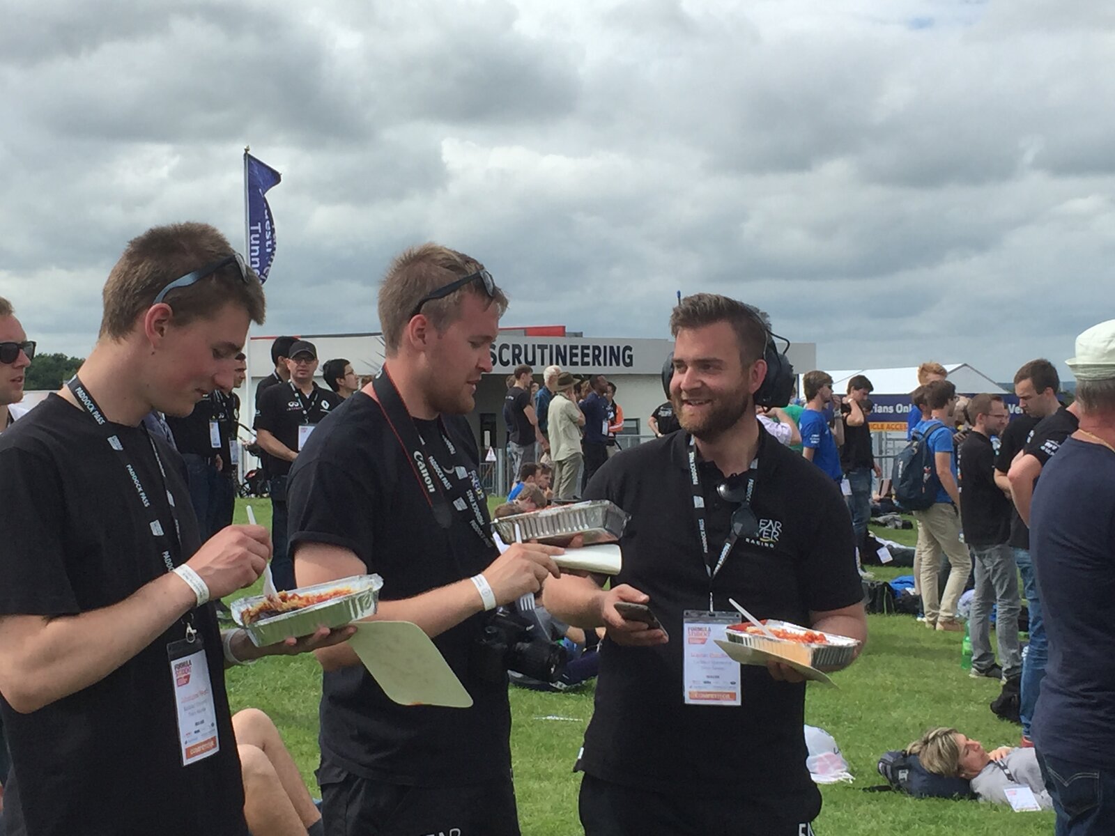 Martin and the team in the paddock at Formula Student — pasta and headsets