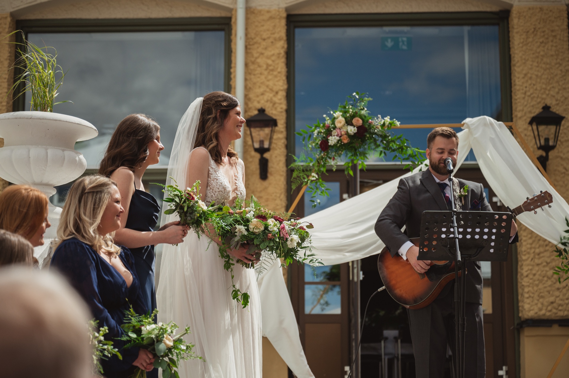 Martin singing Paper Rings at my wedding while I try not to cry